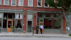 Business owner meets financial advisor outside downtown restaurant Stock Footage