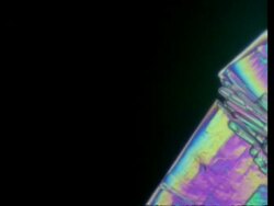 T/L CU colourful crystals grow across frame Stock Footage