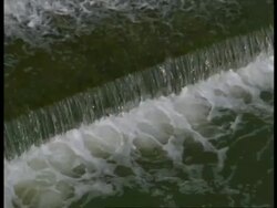 Weir, Bath, Avon - CU water of river Avon flows over step Stock Footage