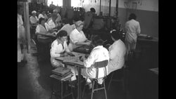 Workers in factory in US making bullets during Korean War News Clip
