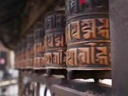 MS Spinning prayer wheel outside temple / Kathmandu, Banke District, Nepal Stock Footage