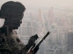 Composite image of woman with tablet device and city Stock Footage