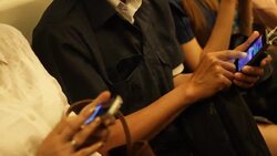 Crowded people in the mass public transportation using their phone Stock Footage