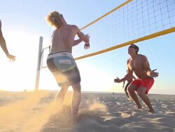 Men playing beach volleyball. - Slow Motion - filmed at 240 fps Stock Footage