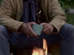 Cowboys sit around a fire Stock Footage