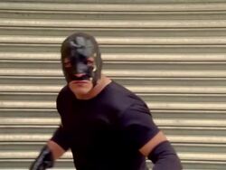 Medium shot luchador 'Shadow' turning to pose/ Monterrey, Mexico Stock Footage