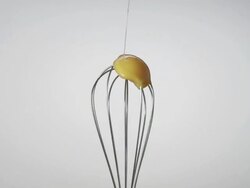 CU SLO MO Shot of egg yolk getting smashed while falling into spinning eggbeater / Munich, Bavaria, Germany Stock Footage