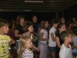 CLEAN: Deejay priest gets them rocking for Jesus on Italian beach News Clip