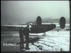 1943: ALEUTIAN ISLANDS CAMPAIGN: UNITED STATES BOMBERS: VS Consolidated B-24 Liberator heavy bomber aircraft engines starting, taxiing on airfield base in Amchitka, Alaska, various B-24 bombers taking off from runway, airstrip. WWII, Pacific Front Instructional Video