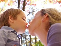 Mother and son kiss Stock Footage