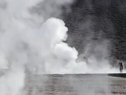 WS Women standing in geyser fields and taking pictures and admiring scene of vapour coming out from ground  / Geiser del Tatio, Atacama desert, Chile Stock Footage
