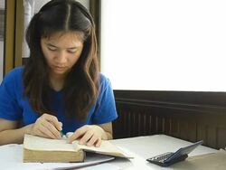 Thai girl student highlight note on old book Stock Footage