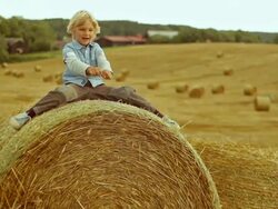 Boy having fun on the bundle Stock Footage