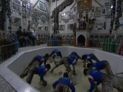Group of men doing excersises in arena, House of strength, Esfahan, Iran (sound available) Stock Footage