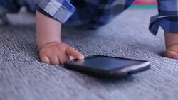 baby playing mobile phone Stock Footage