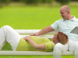 HD: Pregnant Woman Lying On Husband's Lap Stock Footage