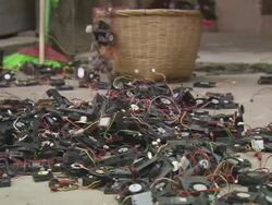 MS Child picking computer component in basket / China Stock Footage