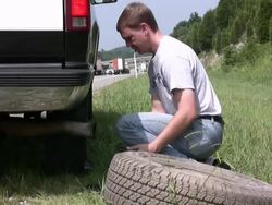 Changing a flat tire Stock Footage