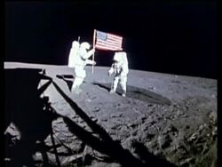Apollo 14 Astronauts Shepard and Mitchell placing U.S. flag on Moon surface Stock Footage