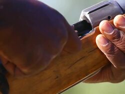 CU Shot of man's hands loading high caliber hunting rifle / Ongava, Kunene, Namibia Stock Footage