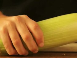 Boy peeling corn Stock Footage