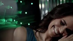 Hollywood actress smiles and leans on her man in back of limousine while cameras flash outside at awards show Stock Footage