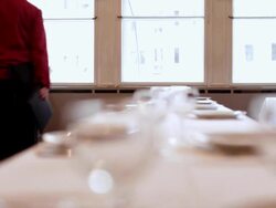 Chef serving a menu to mature woman, dolly shot Stock Footage