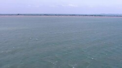 Aerials: Officials inspect dinghy - Group of migrants rescued from sinking inflatable boat in the English Channel News Clip