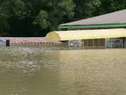 May 9, 2011 Mississippi River Flooding, flood waters nearly reach the top of an awning at a business in Memphis, Tennessee, USA Stock Footage