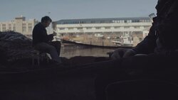 Fishermen at work cleaning and fixing fishing nets Stock Footage