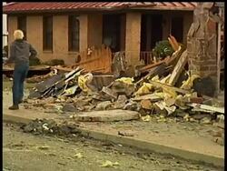 Authorities began a house-to-house search Friday to check on residents after a tornado made a 'direct hit' on this mountain community, killing at least three people, injuring at least 30 others and flattening homes and businesses. News Clip