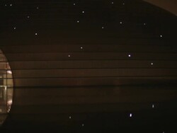 MS PAN National Grand Theater reflecting in lake at night / Beijing, China Stock Footage