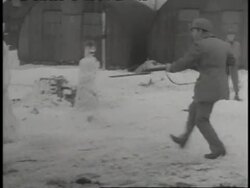 Soldiers make Adolf Hitler snowmen then run and stab the snowmen with bayonets. News Clip