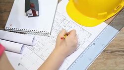 Architect working on blueprint Stock Footage