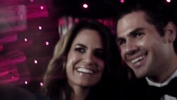 Celebrity couple pose for own photos with smartphone while paparazzi cameras flash outside at awards show Stock Footage