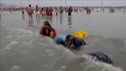 CLEAN : Hindu pilgrims take a holy dip News Clip