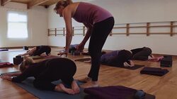 Yoga instructor with students in a studio Stock Footage