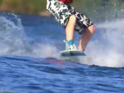 SLO MO Cable wakeboarders on lake Stock Footage
