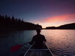 Canoeing at Sunset Stock Footage