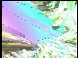 Rotate and zoom in to colourful crystal, fan like crystal shards Stock Footage