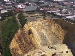 MS AERIAL ZO View of cinema on top of mine dump in Johannesburg / South Africa Stock Footage