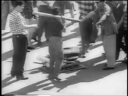 B/W 1959 crowd of men around destroyed machine after revolution / Havana / newsreel Stock Footage