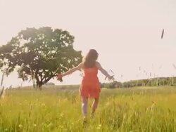 TS Girl running barefoot in the grass Stock Footage