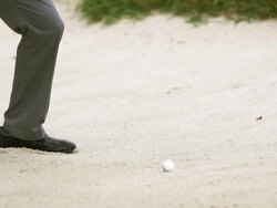 Slow motion golf hit out of a sand trap Stock Footage