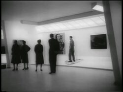 B/W 1959 people watching as workman adjusts artwork in Guggenheim Museum / NYC Stock Footage
