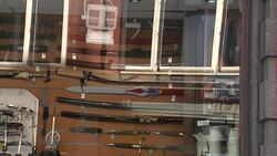 Knives on display in shop window News Clip