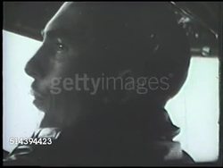 1943: ALEUTIAN ISLANDS CAMPAIGN: UNITED STATES BOMBERS:  VS Squadron of Consolidated B-24 Liberator bomber aircrafts flying, pilot inside talking, B-24s flying over water (flying toward Kiska island, Alaska). WWII, World War II, Pacific Front Instructional Video