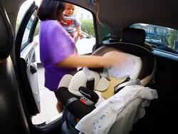 HD:Mother take care her baby on seat belt. Stock Footage
