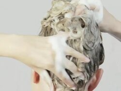 Beautiful Young Women Washing Her Har. Stock Footage