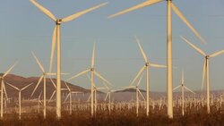 Part of the Tehachapi Pass wind farm, the first large scale wind farm area developed in the US, California, USA, at sunrise. Stock Footage
